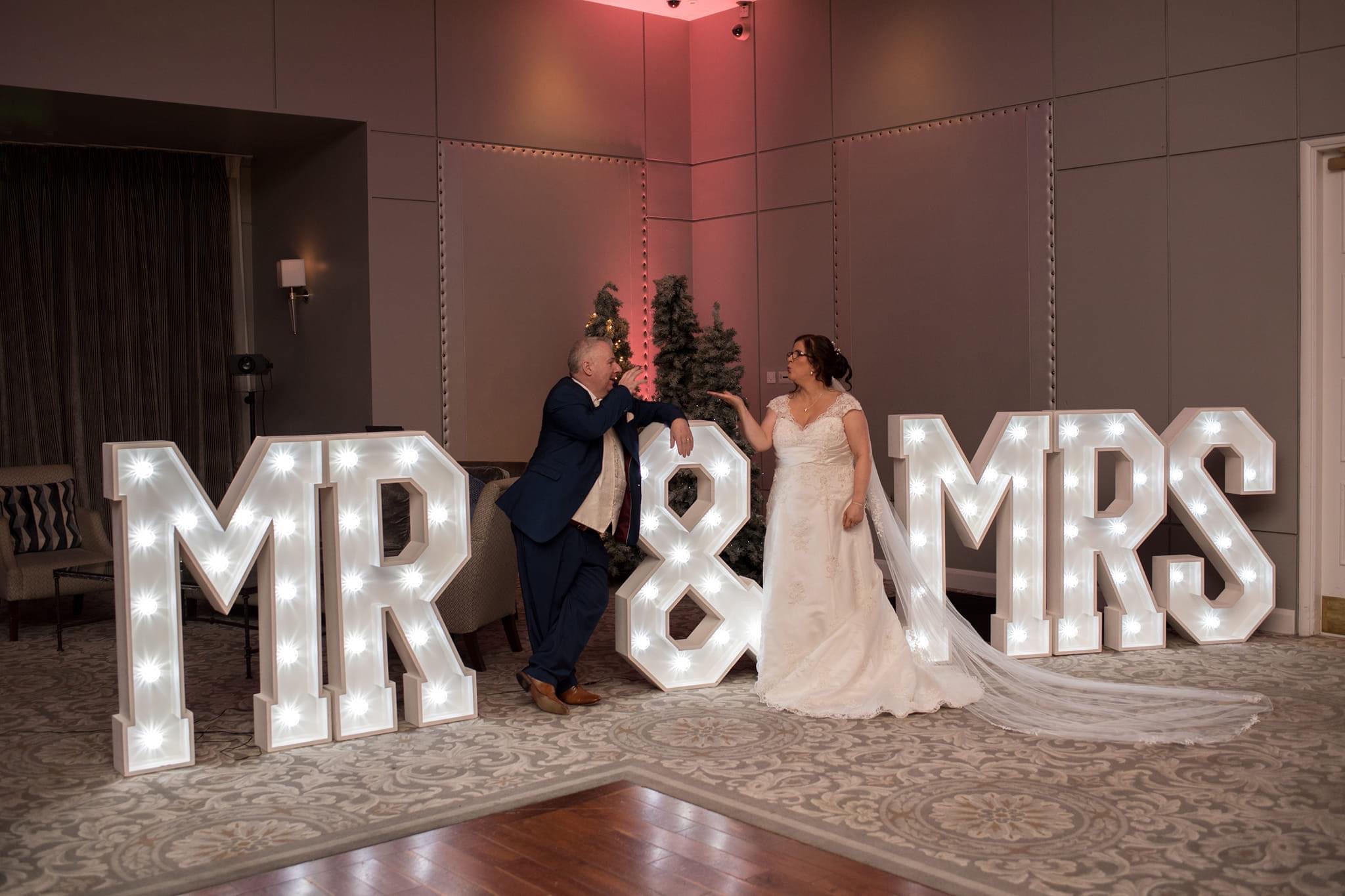 Mr & Mrs LED giant letter sign with Bride & Groom